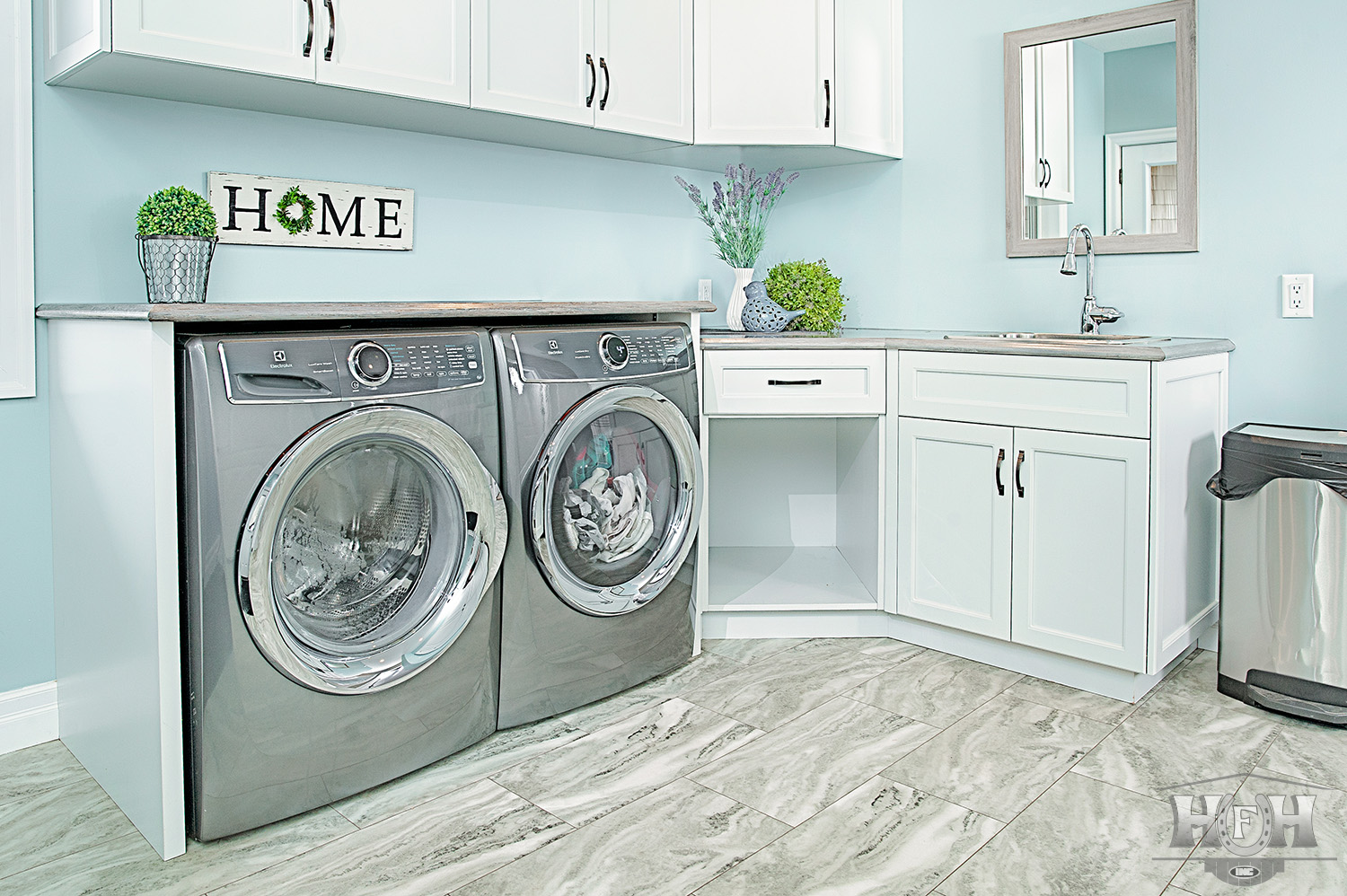 Laundry area with large electrolux washer and dryer