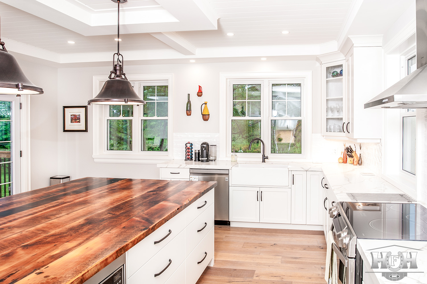 kitchen island with wood countertop and two double windows